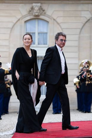 Jean-Michel Jarre and his wife Gong Li at the dinner in honor of the Chinese president at the Elysée.